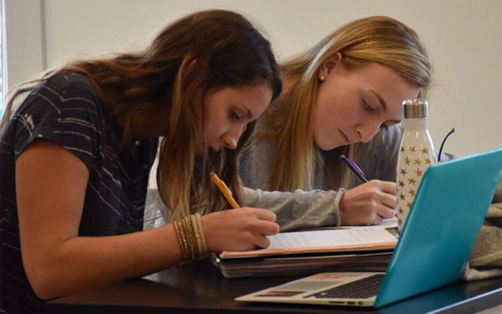 Green Mountain Valley School student-athletes studying on the school campus.